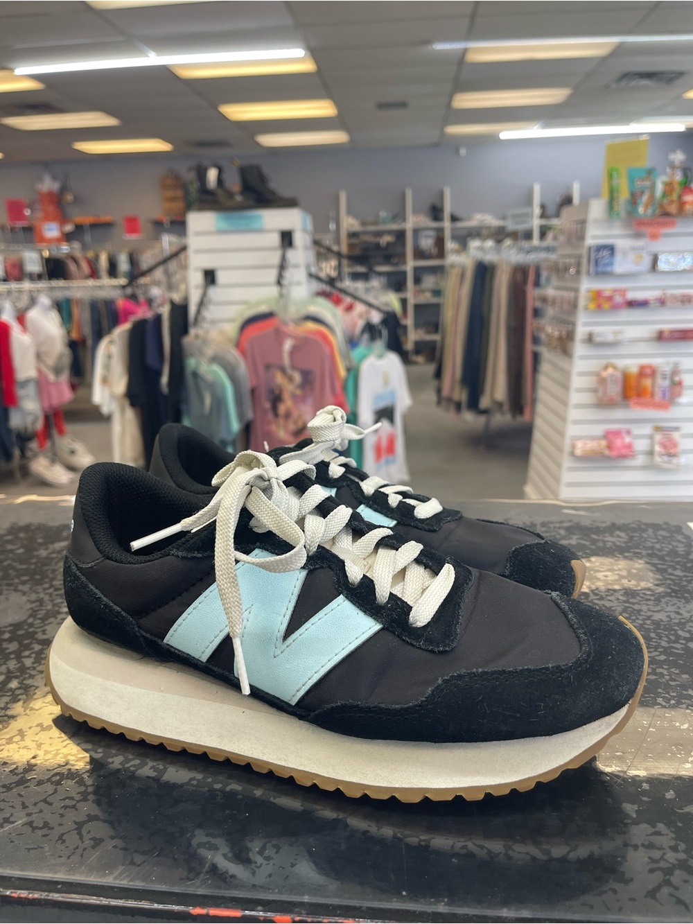 New Balance Black Sneakers with Light Blue 'N' Accent